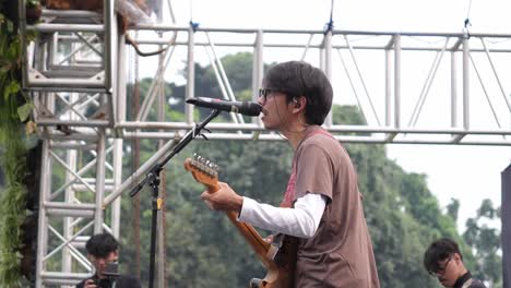 Fiersa-Besari-Famous-Indonesian-Singer-Singing-On-Stage-With-Band-During-Music-Festival