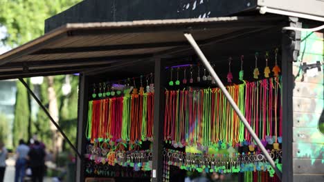 A-vibrant-display-of-handmade-bracelets-hanging-in-a-street-market-stall