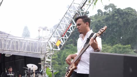 Indonesian-men-performing-guitar-music-on-stage