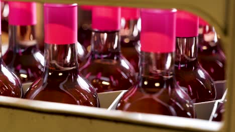 Red-Wine-Bottles-with-Pink-Caps-Ready-for-Packaging