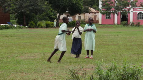 Kids-with-school-uniform-on-green-meadow-in-Uganda