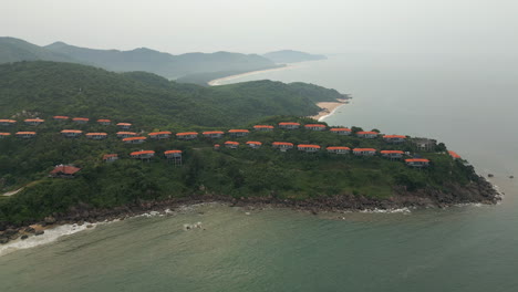 Premium-Holiday-Villas-On-Chan-May-Bay-Peninsula-Look-Out-Over-Deep-Blue-Green-Ocean-4K