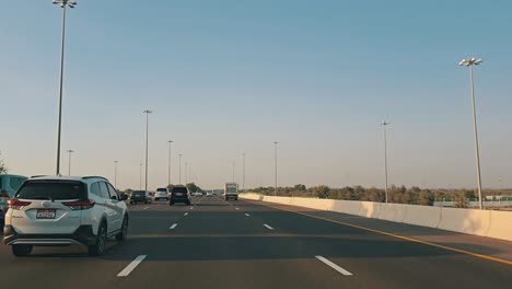 Traffic-navigates-through-Abu-Dhabi-E11-Sheikh-Maktoum-Bin-Rashid-road-towards-Dubai-on-the-third-lane,-which-is-limited-to-drivers-with-a-speed-limit-of-100-km-and-below