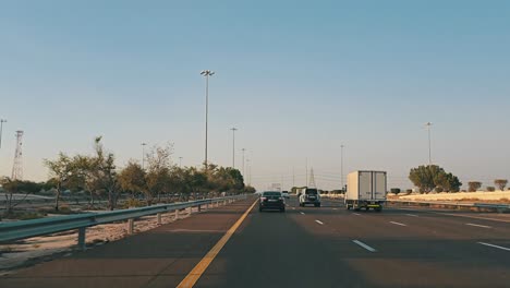 Traffic-navigates-through-Abu-Dhabi-E11-Sheikh-Maktoum-Bin-Rashid-road-towards-Dubai-on-the-first-lane,-which-is-limited-to-drivers-with-a-speed-limit-of-140km-and-below