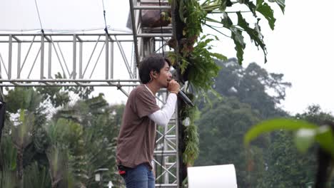 Fiersa-Besari-Famous-Indonesian-Singer-Singing-On-Stage-At-Outdoor-Music-Festival