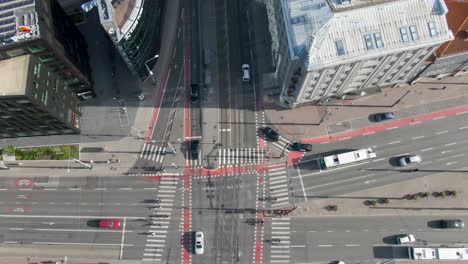 A-drone-footage-of-cars,-vehicles-and-public-transportation-driving-on-an-intersection-in-Tallinn-Estonia-Freedom-square-located-in-Europe,-Baltics