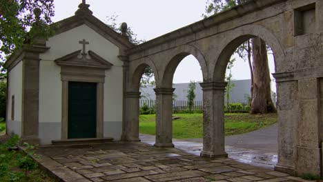 A-static-shot-of-a-little-christian-chapel-in-a-park-in-Porto