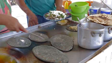 Street-food-Mexico-city,-food-cart-tortilla-making,-cooking-up-close