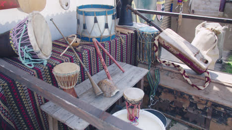 Beautiful-slow-motion-shot-of-a-group-of-handmade-musical-instruments-inside-a-medieval-fair-in-southern-Spain,-Andalusia