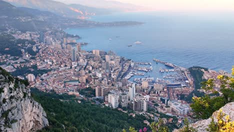 The-Principality-of-Monaco,-viewed-from-a-cliffside-overlook-in-France-looking-towards-Monte-Carlo,-Fontvieille-and-Port-Hercule-during-the-Formula-1-Monaco-Grand-Prix