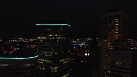 aerial-footage-downtown-buildings-at-night