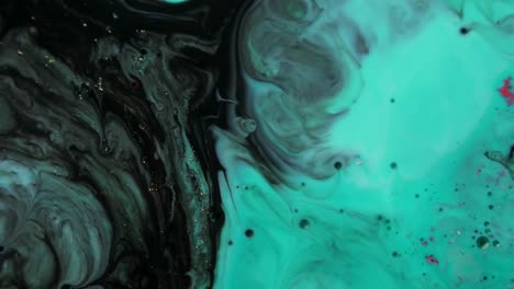 Black-and-teal-acrylic-chemical-reaction.-Slow-motion