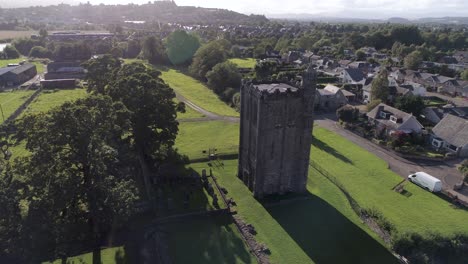 Aerial-pan-and-orbital-shot-of-Cambuskenneth-Abbey-in-Stirling-on-a-sunny-day