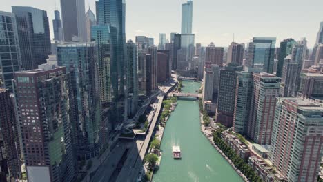 Aerial-rising-Chicago-downtown-skyline-building-and-drone-view-along-skyscrapers-at-sunny-day