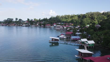 Aerial-view-of-rustic-homes-along-the-coastline-of-Bastimentos-Island-in-Panama